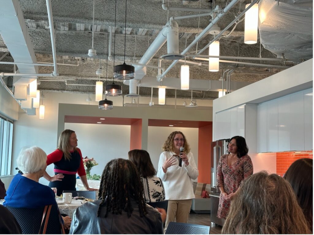 Carolyn delivering a speech in the FMP Office. 