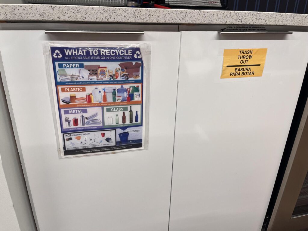 Signs on trash and recycling bins